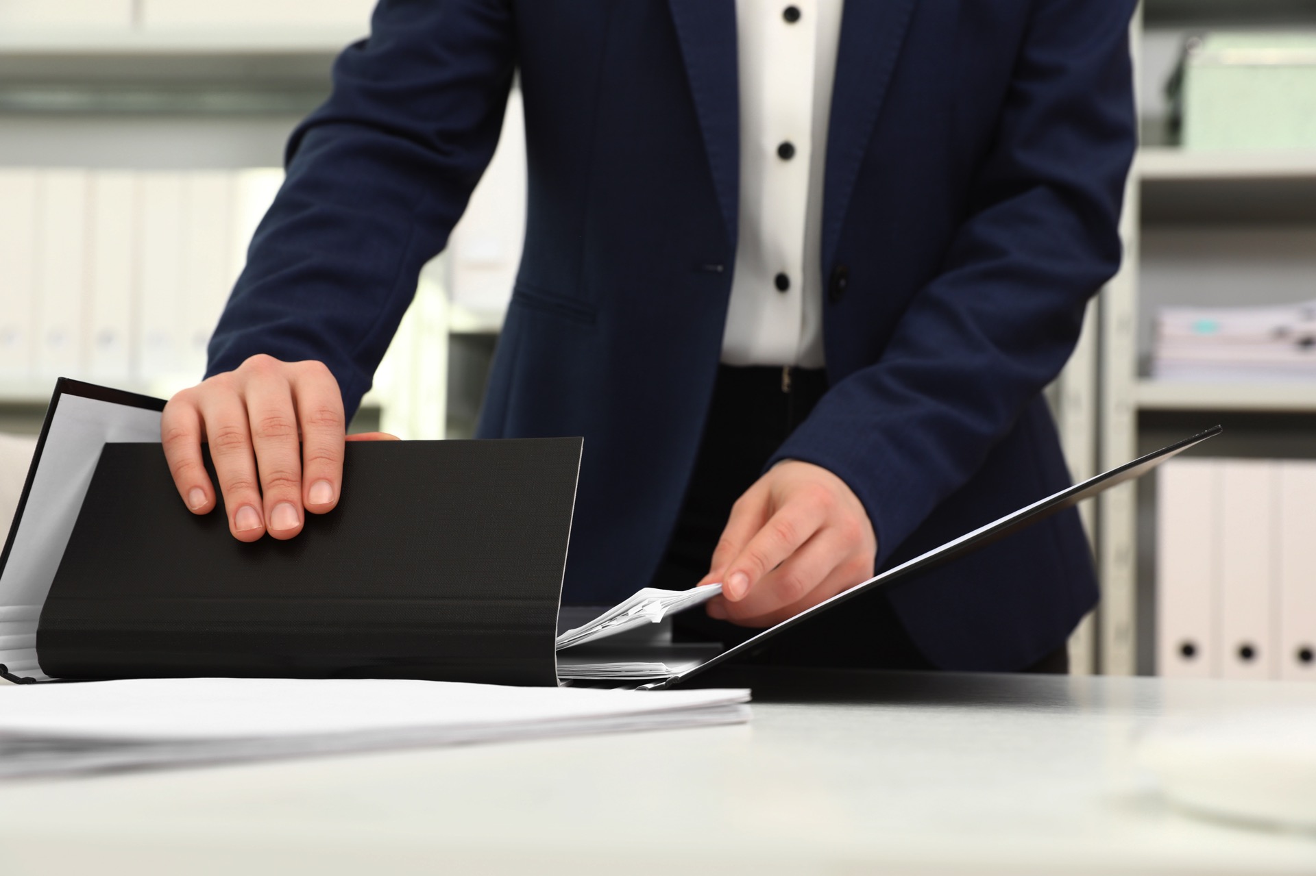 Woman working with documents at table in office, closeup Rivington Solicitors